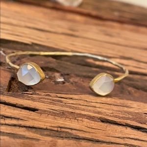 Gold cuff bracelet with gems